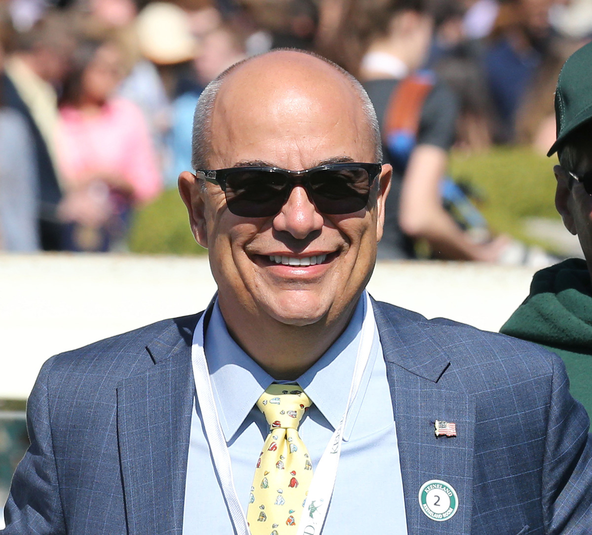 Trainer Mark Casse grins at the camera from the side of the track, the energy of the latest race bustling behind him. (Photo: ©Coady Media)