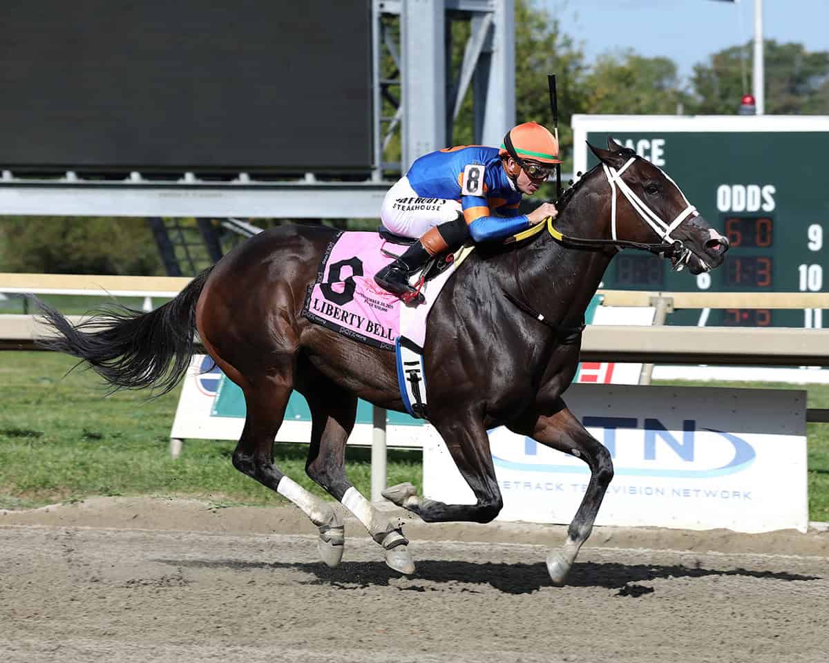 Florida-bred Thoroughbred Mystic Lake, guided by jockey Tyler Gaffalione, gallops fast to the wire at Parx Racing to win the 2025 Liberty Bell. (Photo: ©Bill Denver/EQUI-PHOTO)
