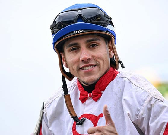 Jockey Samuel Marin smiles at the camera, flashing a thumbs up post ride. (Photo: @SV Photography)