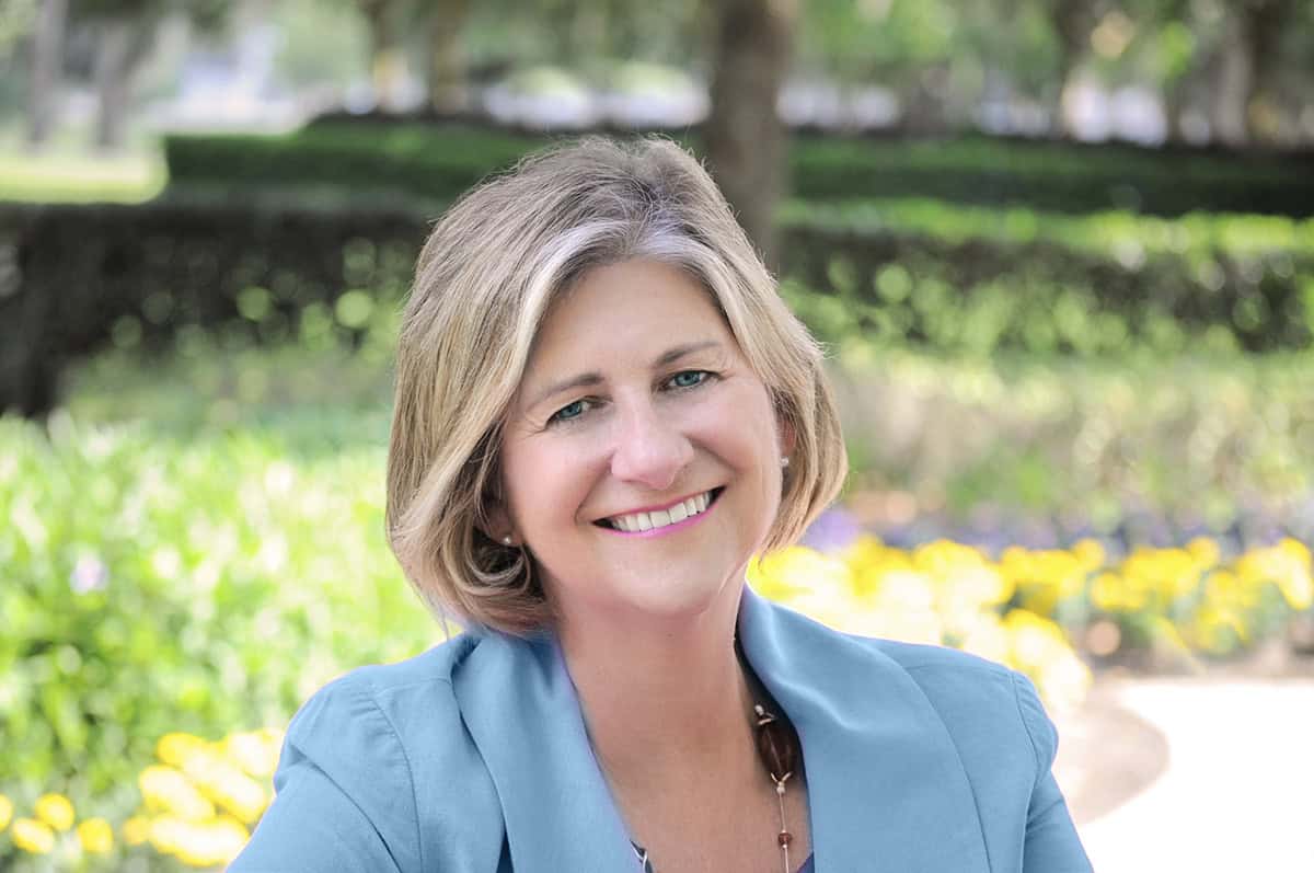 Headshot of FTBOA President Valerie Dailey in front of outdoor greenery.