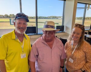 From left to right, Norman Dellheim, Eddie Woods and Katie Liebe stand for a photo together trackside at the OBS Sale grounds training track. (Photo Courtesy: TOBA)