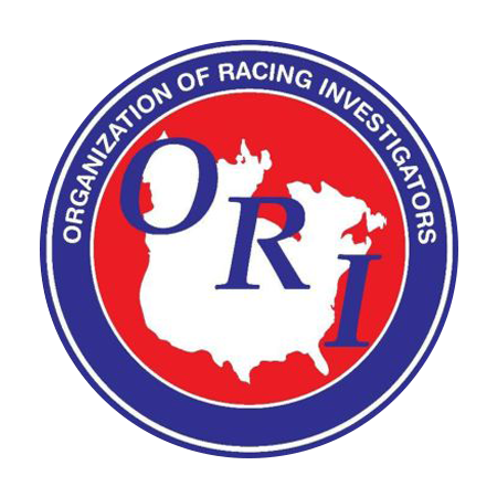 Circular logo for the ORI. The logo consists of a red circle with a solid white graphic of the United States centered in the middle of it. The US is overlapped by the blue serif letters, “ORI.” A thick blue frame encircles the red, outlined in white. The blue frame contains the full name of the organization, Organization of Racing Investigators.