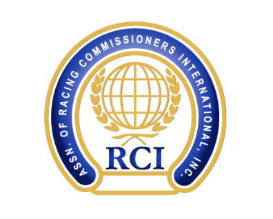 Horseshoe-shaped badge logo for RCI. The logo is outlined in gold, with a navy blue band running along the inside of the “shoe” that features all capitalized lettering spelling out the full name of the organization, “Assn. of Racing Commissioners International, Inc.” In the middle of the shoe, an outlined globe in gold, framed by fronts, is centered over the blue letters of “RCI.”