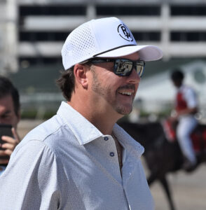 Profile shot of Rich Averill, taken as he smiles while watching the racetrack. (Photo by ©Lauren King)