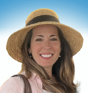 Headshot of Alex Roman posing for a photo, wearing a sun hat. The background of the photo is solid white, fading into a soft blue at the top of the image.