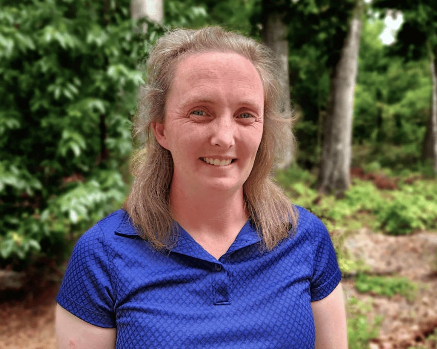 Headshot of Dr. Gemma Cock, BVM, MRCVS, DACVIM, framed by greenery in the background. (Photo Courtesy: Peterson Smith Equine Hospital + Complete Care)