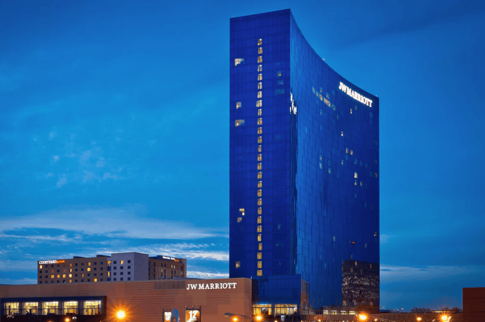 The JW Marriott hotel, host of the 2026 ARCI Conference, stretches into the skyline of Indianapolis, Indiana, backlit by a cloudy nighttime sky. (Photo: JW Marriott’s Website)