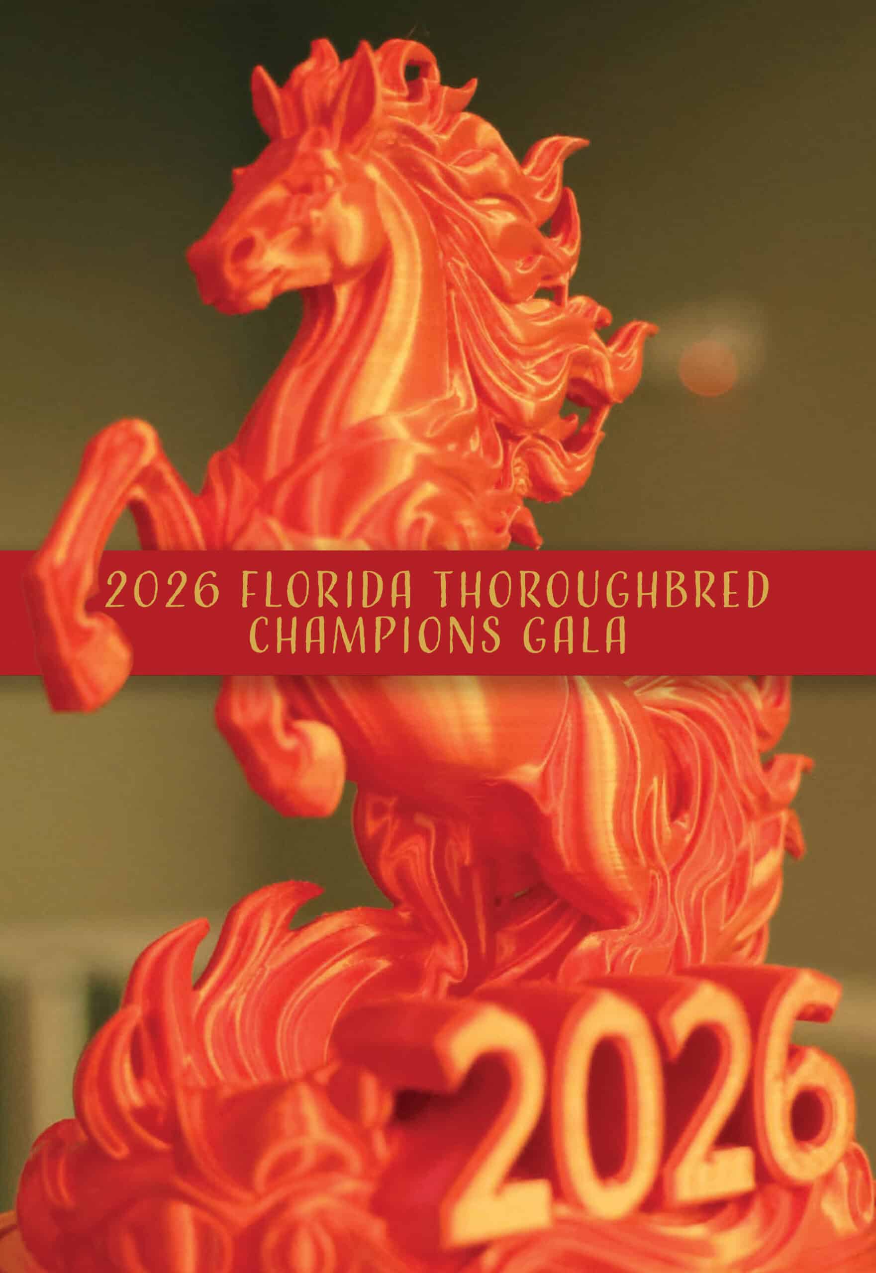Photo of the award trophy, a 3D printed, flame-colored horse rearing over the year (2026) and FTBOA, which is embossed on the base. A red rectangle with gold text reading, “2026 Florida Thoroughbreds Champions Gala,” runs through the middle of the image with shadowing behind it. The horse’s right front hoof overlaps the banner.