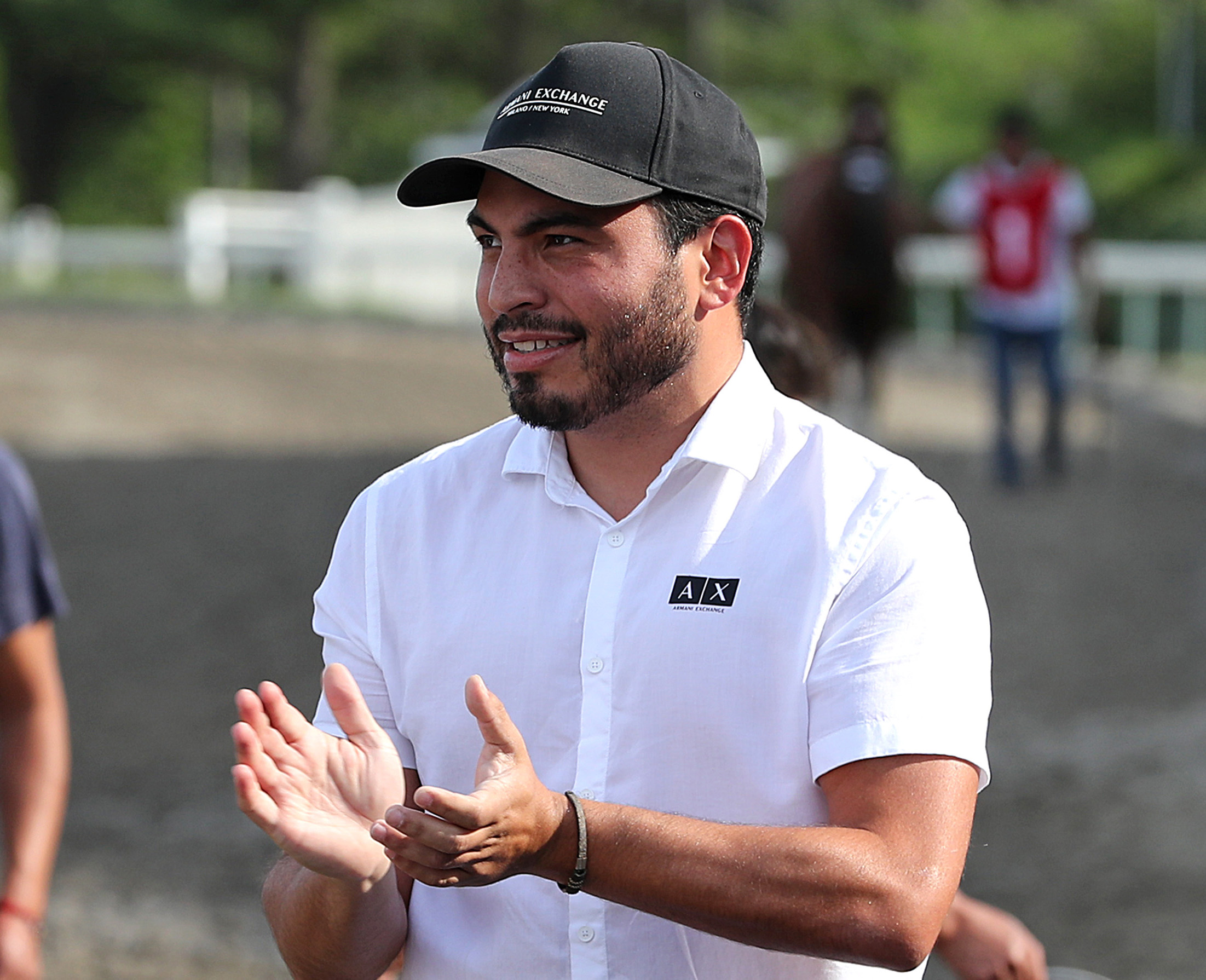 Photo of racehorse trainer Jorge Delgado claps trackside after Winfromwithin #8 with Carlos Rojas riding won the $100,000 Red Bank Stakes at Monmouth Park Racetrack in Oceanport, NJ on Monday September 5, 2022. (Photo: ©Bill Denver/EQUI-PHOTO)