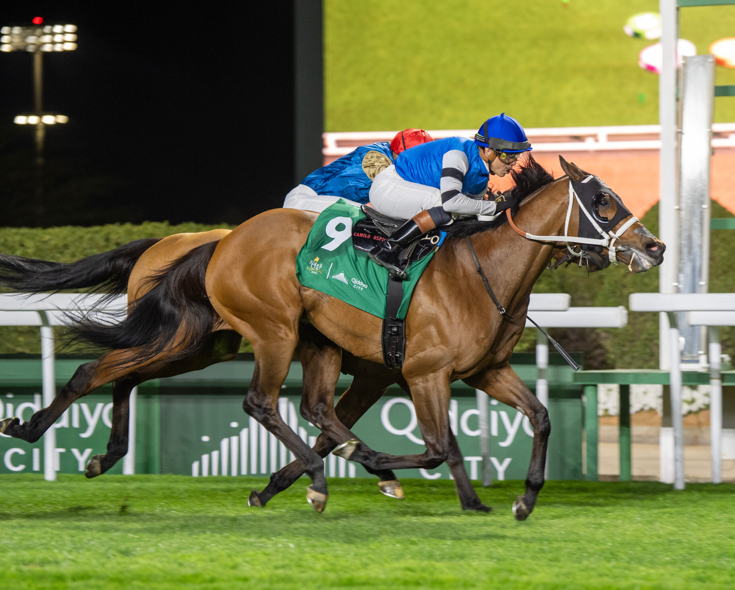 Florida-bred Reef Runner and jockey Irad Ortiz Jr. gallop to the wire at King Abdulaziz Racecourse in Riyadh, closing on their inside-rail competition to win the 2026 $2 million 1351 Turf Sprint presented by Qiddiya City (Group 2) on the Saudi Cup undercard. (Photo: ©Mathea Kelley/JCSA)
