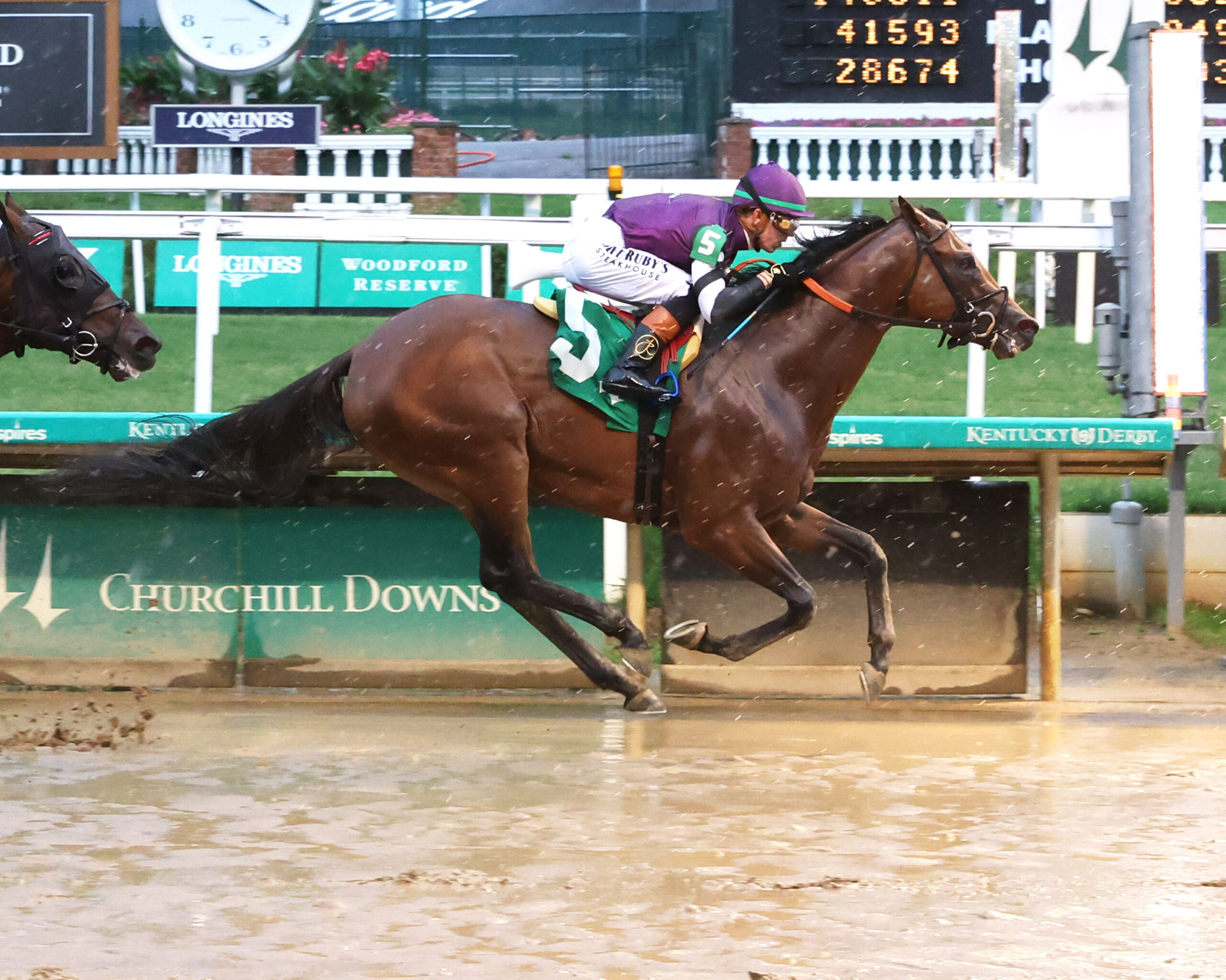 Florida-bred Thoroughbred Rockies Balboa and jockey Tyler Gaffalione gallop to the wire at Churchill Downs to win a $125,000 optional claiming on June 25, 2026. (Photo: ©Coady Media)
