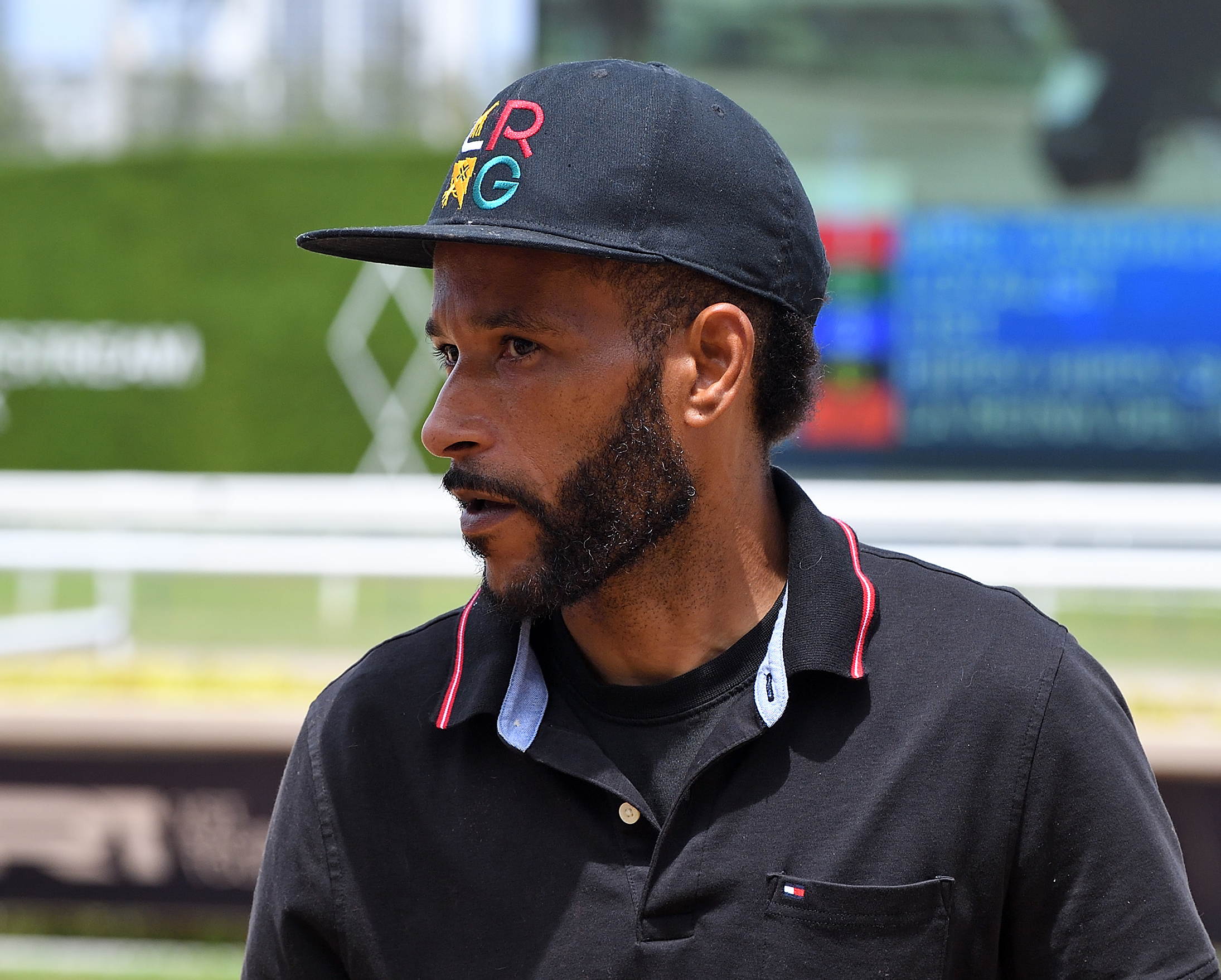 Closely cropped headshot of trainer Jose Alvarado trackside at Gulfstream Park. (Photo: ©Ryan Thompson)