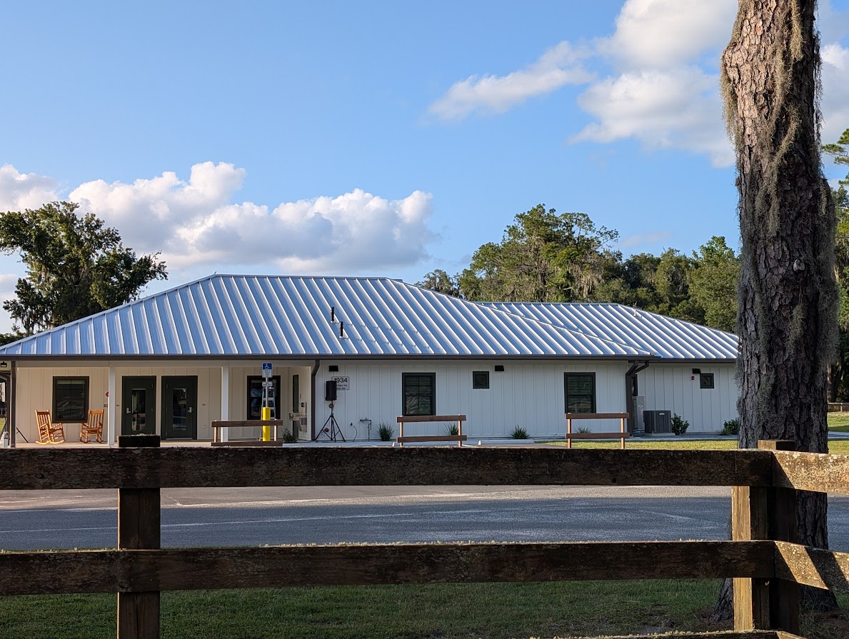 The University of Florida Institute of Food and Agriculture Sciences Department of Animal Sciences Student Complex, a ranch-style house outfitted with white panel walls and a metal roof.