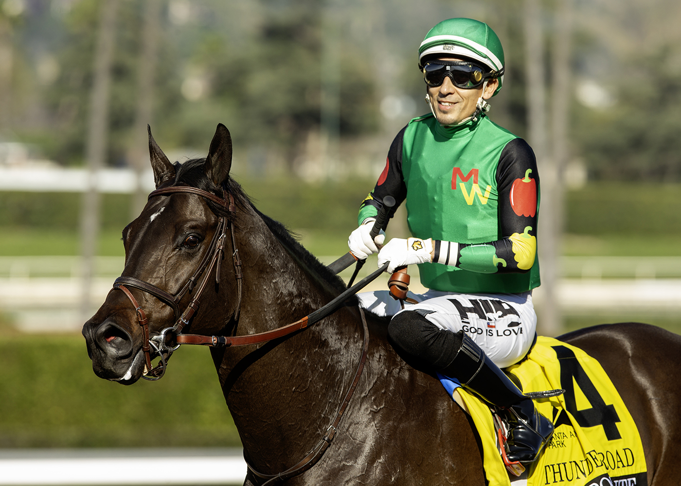 Closely cropped headshot of Florida-bred Thoroughbred El Potente and jockey Hector Berrios, who smiles for the camera, after their win of the 2026 Thunder Road (G3) at Santa Anita. (Photo: ©Benoit)