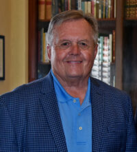 Closely cropped photo taken of Richard Heysek smiling for the camera. (Photo: ©Judit Seipert)