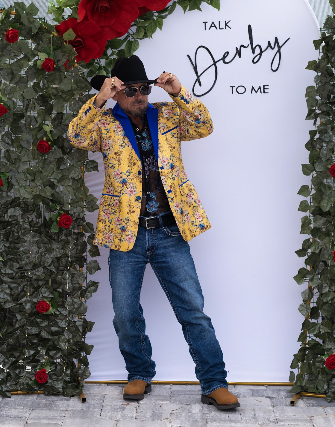 Hal Hatch strikes a pose with sunglasses and a cowboy hat, dressed up for the 2026 Kentucky Derby party. Photo courtesy of Hal Hatch.