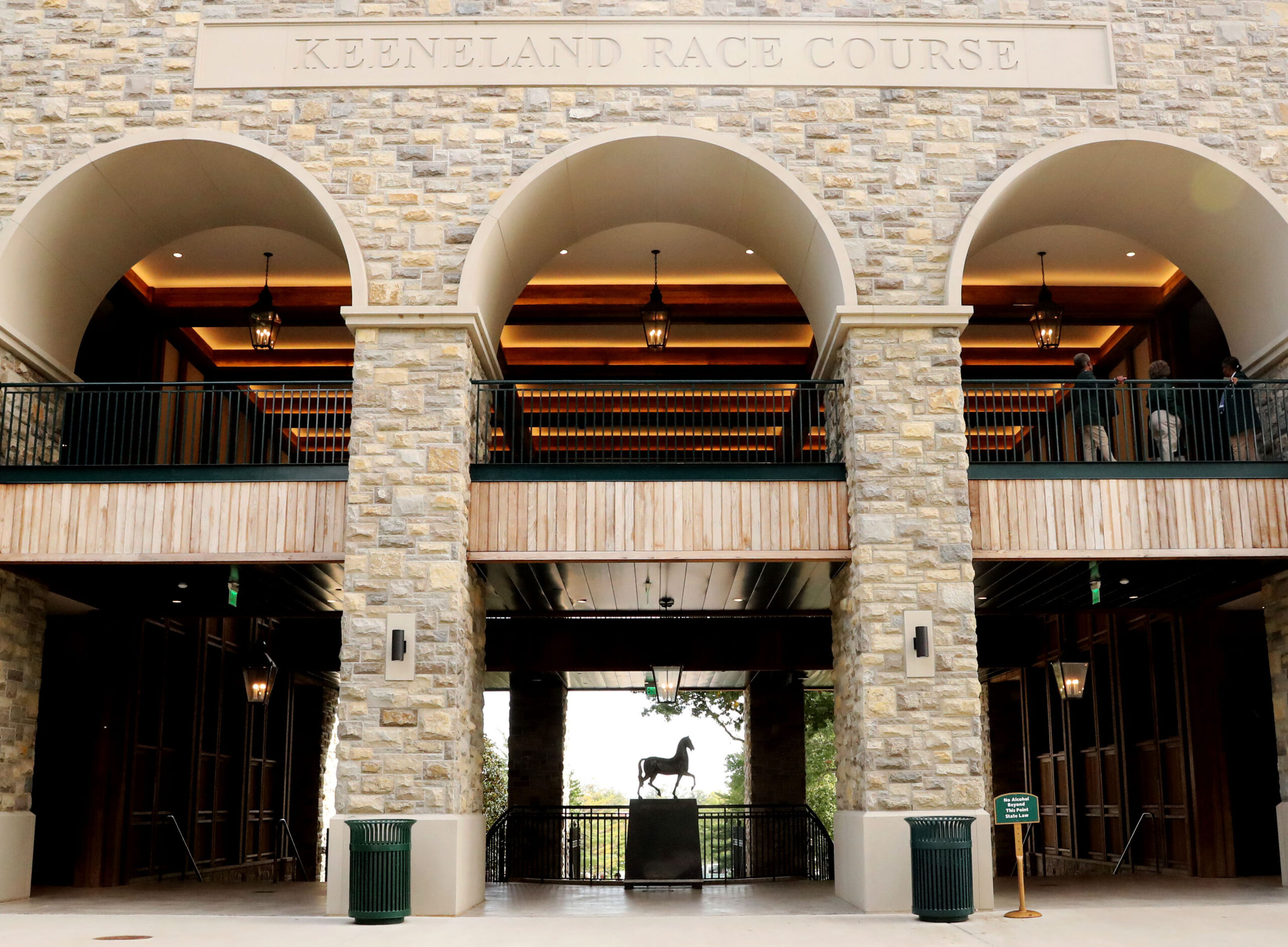 The arched stone work of Keeneland Race Track frames the sculpture representing the Breeders’ Cup, a trotting metal horse on a pedestal. (©Renee Torbit/Coady Media)