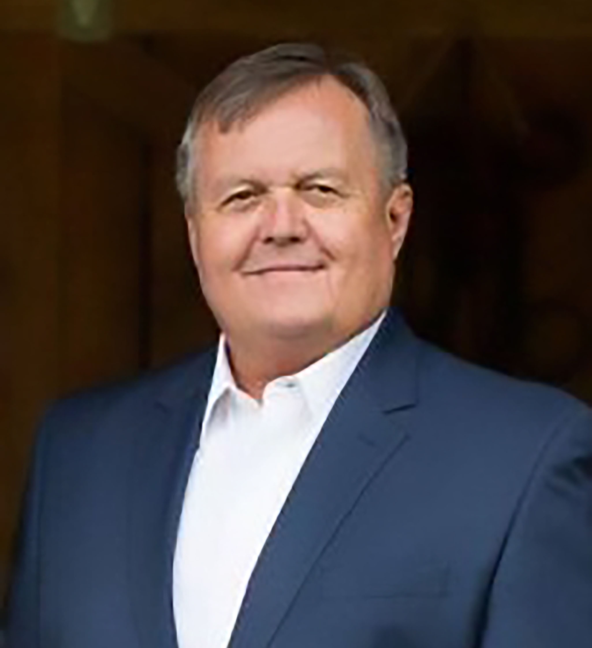 Formal headshot of Richard Heysek as he smiles for the camera.