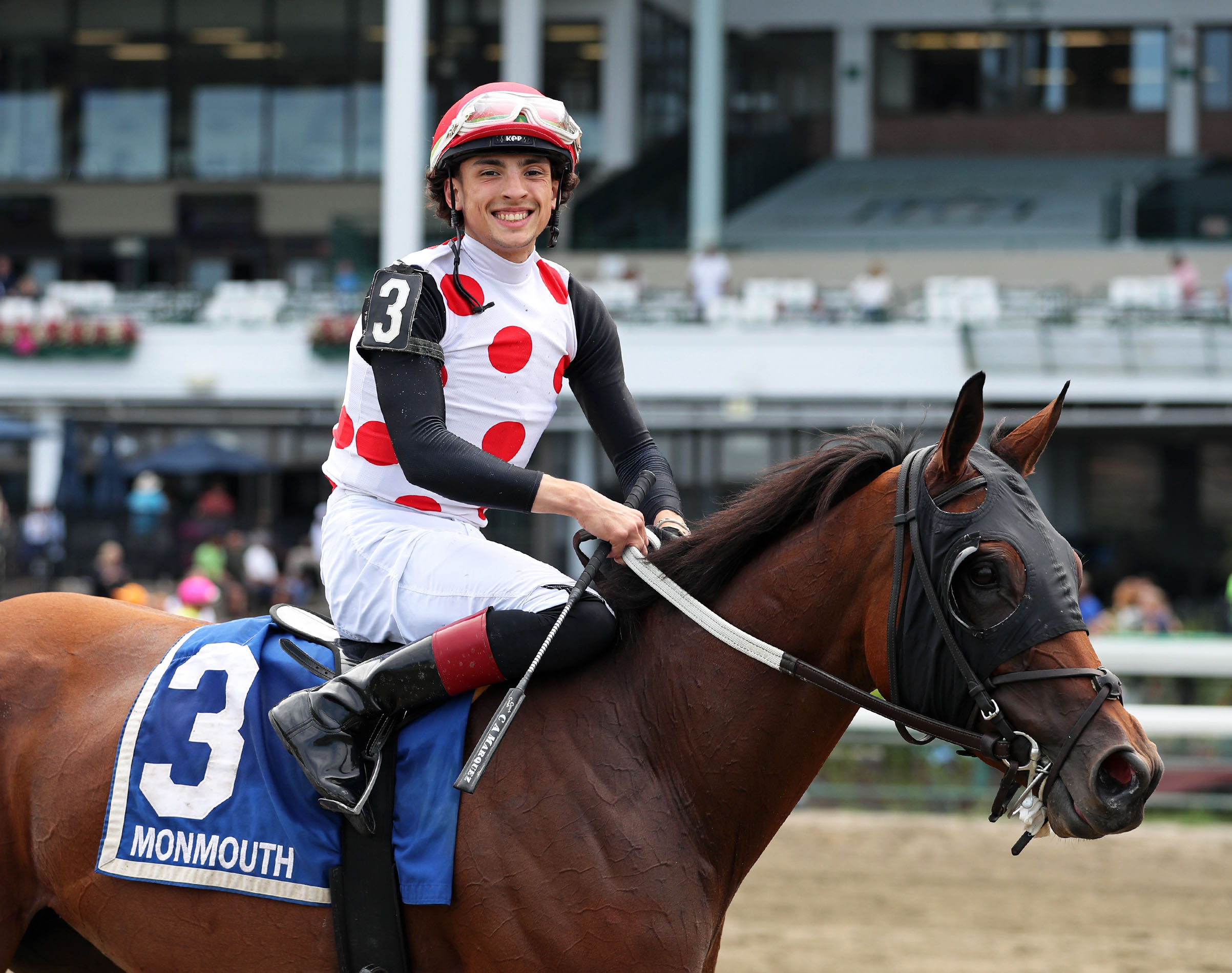 Candid, closely cropped photo of Florida-bred Thoroughbred Souper Williwaw as jockey Charlie Marquez smiles happily at the camera after their win of the 2026 Violet Stakes on the Monmouth Park turf. (Photo: ©Ryan Denver/EQUI-PHOTO)